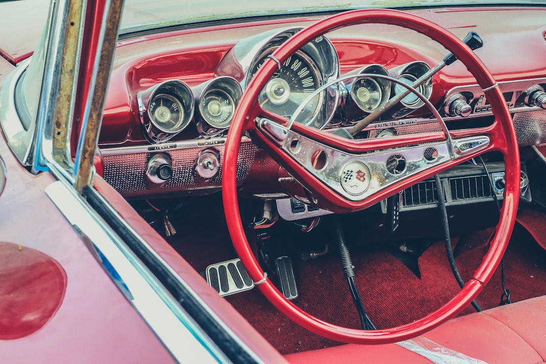 red steering wheel of a classic car