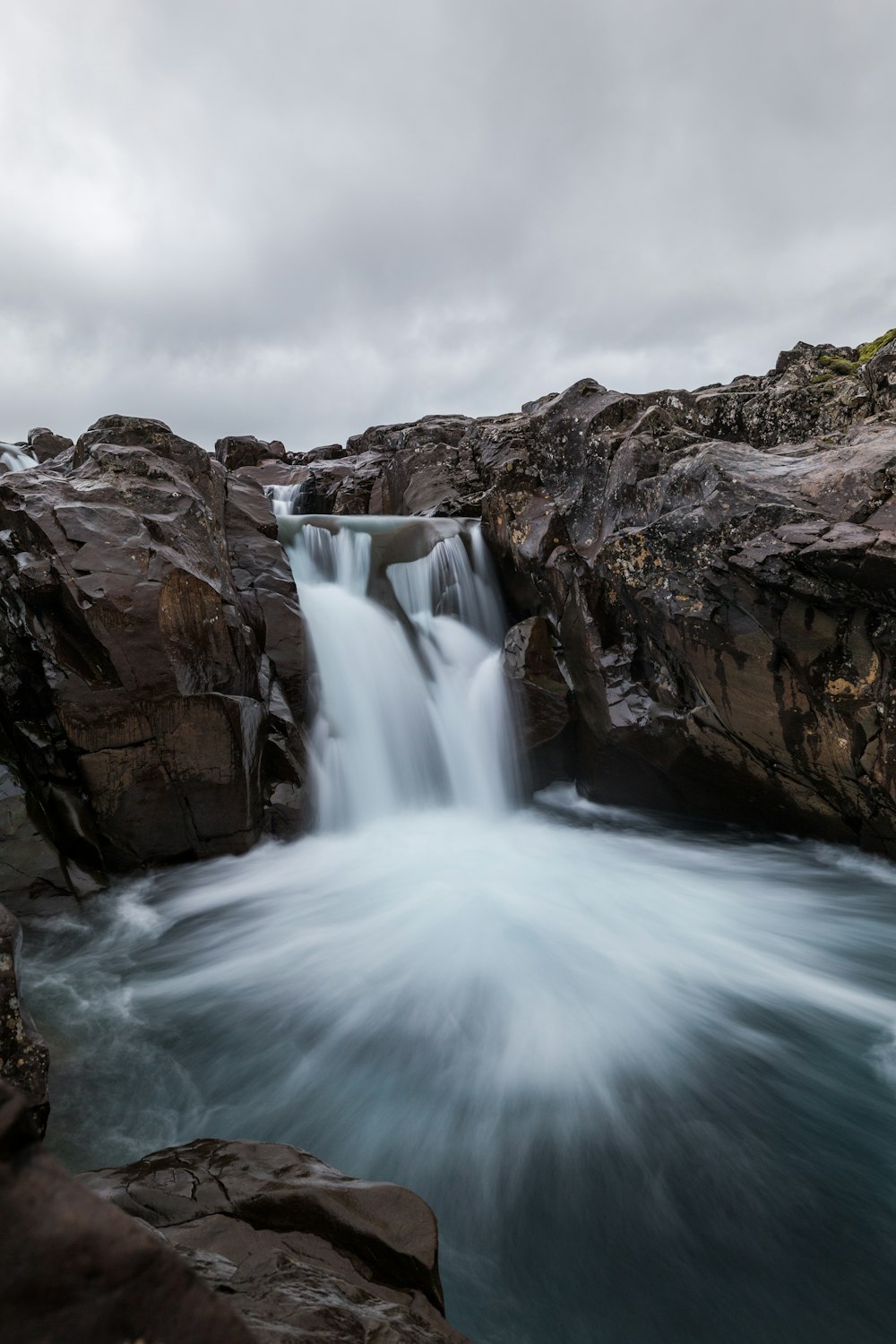 time-lapse photography of flowing multi-tier waterfall