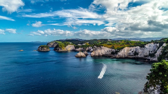 body of water under cloudy sky during daytime in Coromandel New Zealand