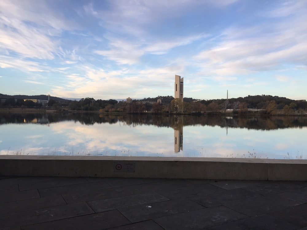 city buildings behind body of water