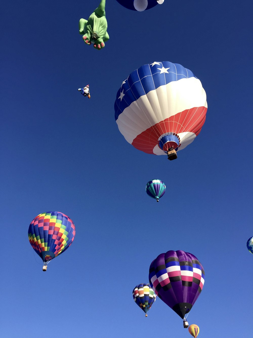 photo of flying hot-air balloons
