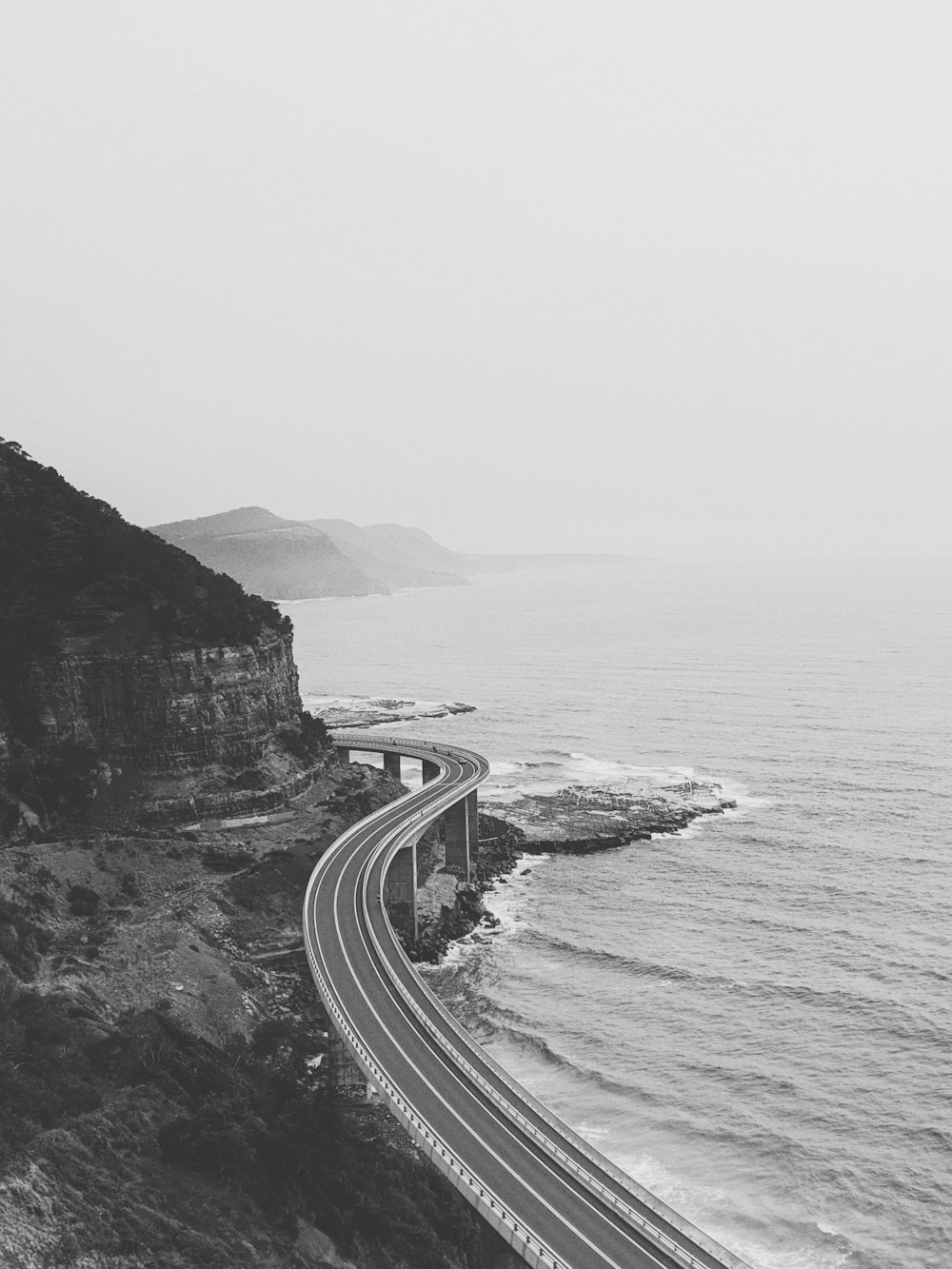 road beside body of water