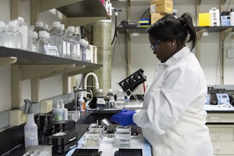 woman standing in front of the sink
