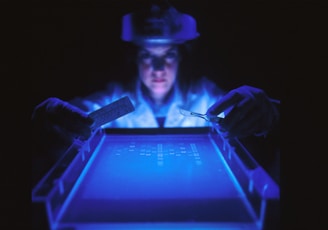 woman doing research while holding equipment