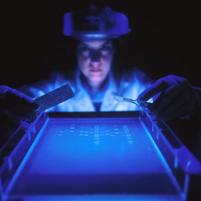 woman doing research while holding equipment