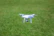 Close-up of DJI Mavic 3 Multispectral drone capturing crop data in a sunny field.