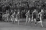 Vintage black and white footage of a classic football match with nostalgic atmosphere