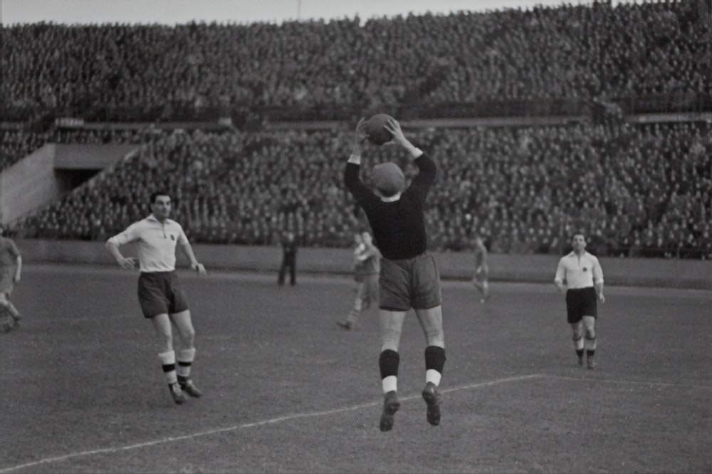 man throwing the ball on the field photograph