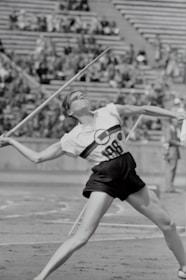 Close-up of a javelin thrower preparing to launch during competition.