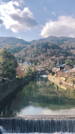 A peaceful river flowing through a valley, reflecting the balance between technology and nature.