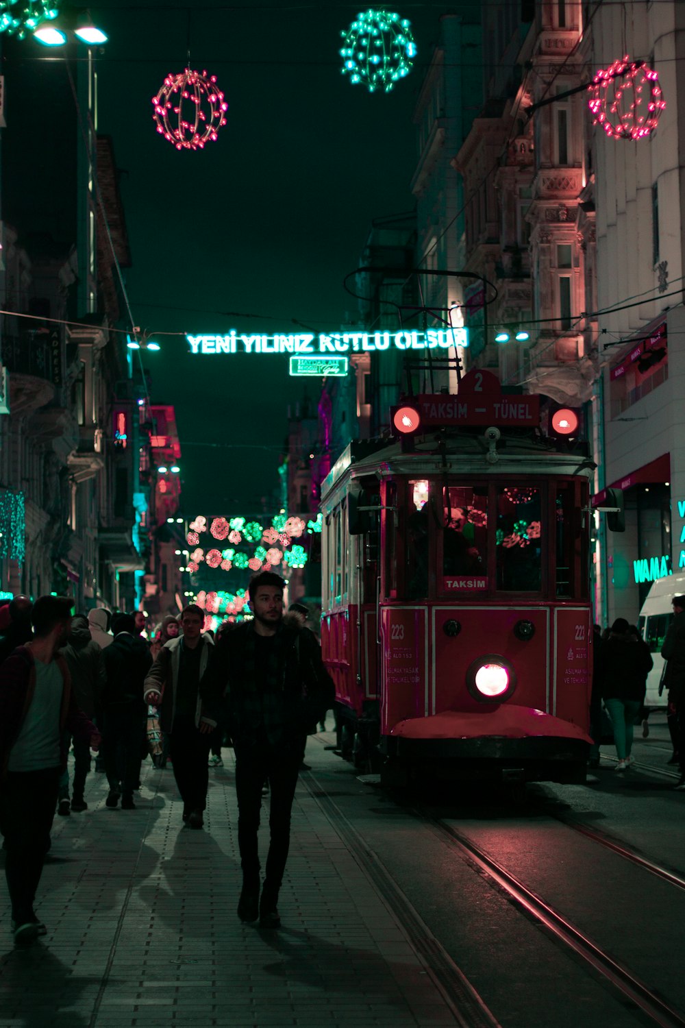 people walking near tram