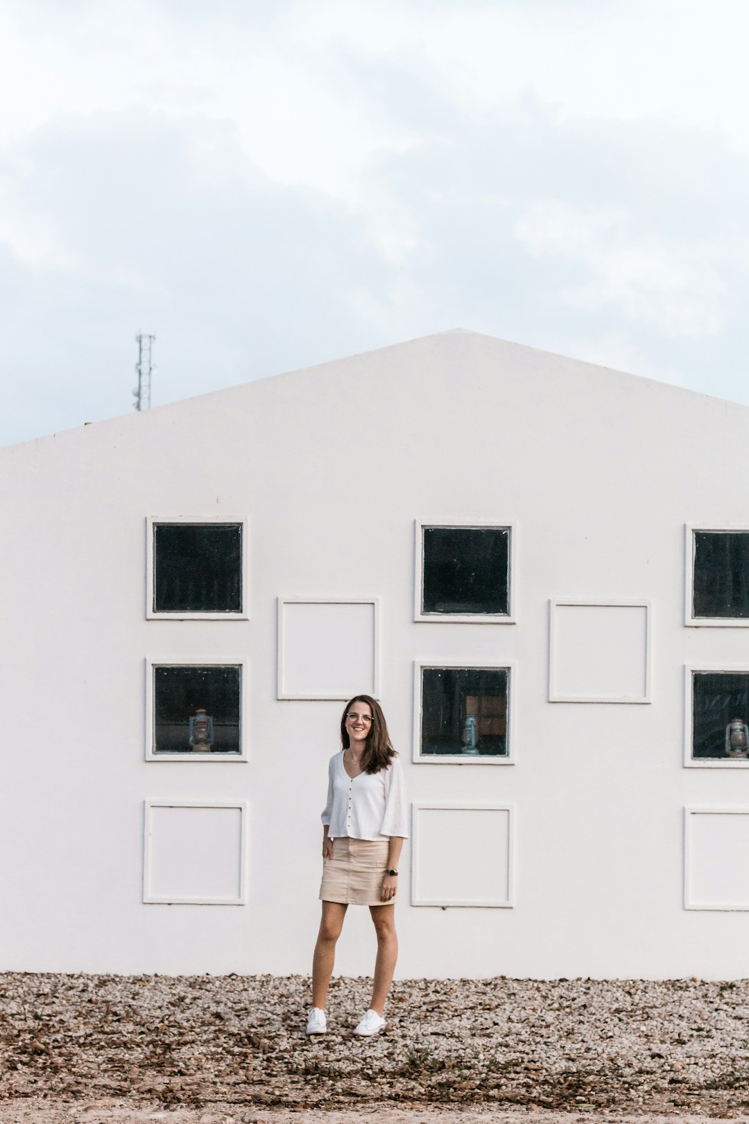 woman standing beside wall