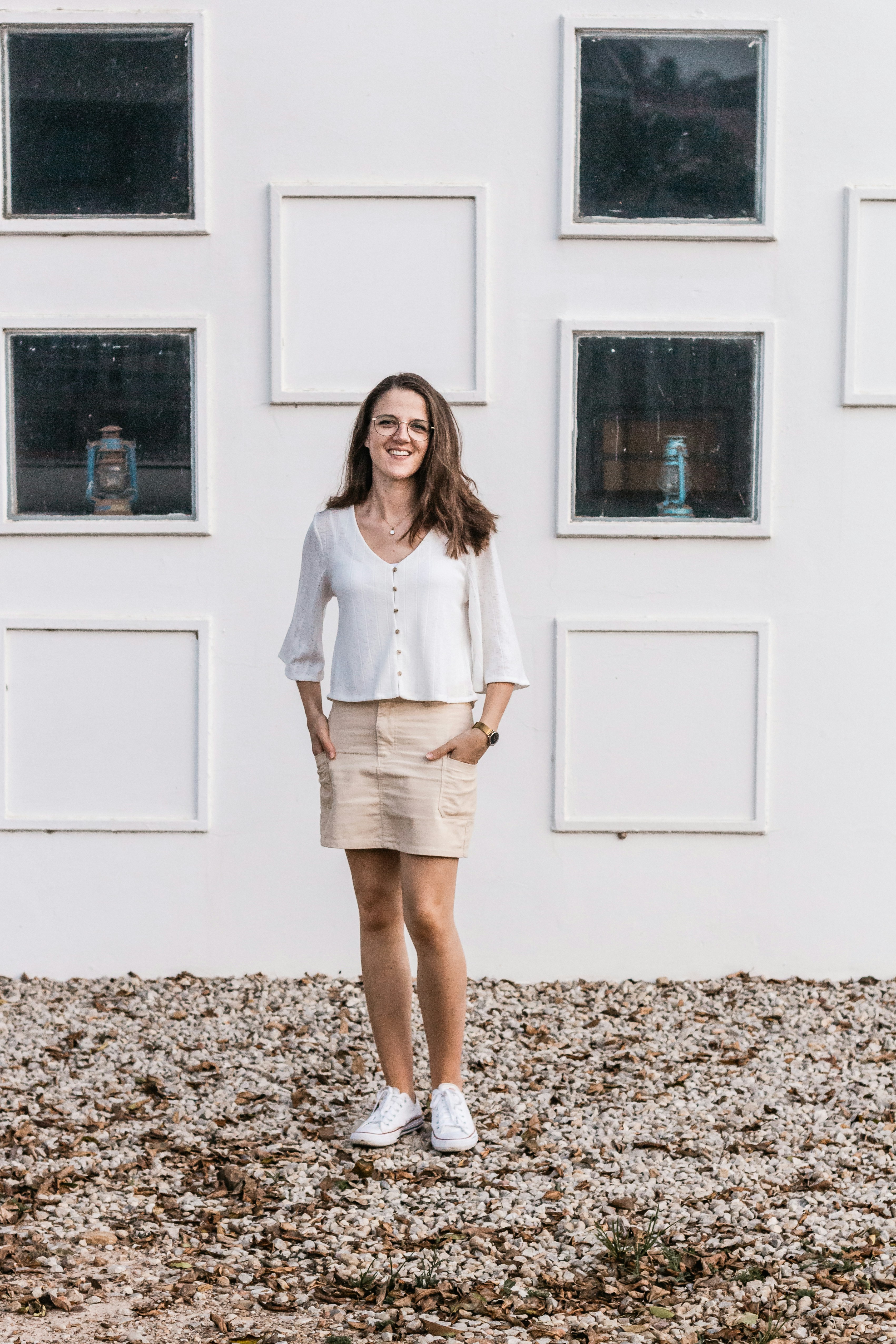 Smiling woman standing in front of her sold apartment