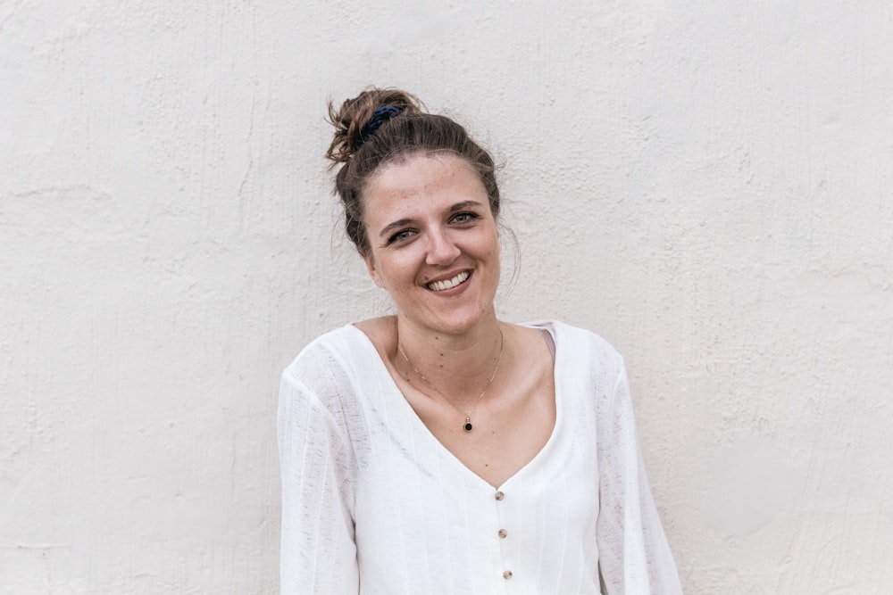 woman standing near white wall