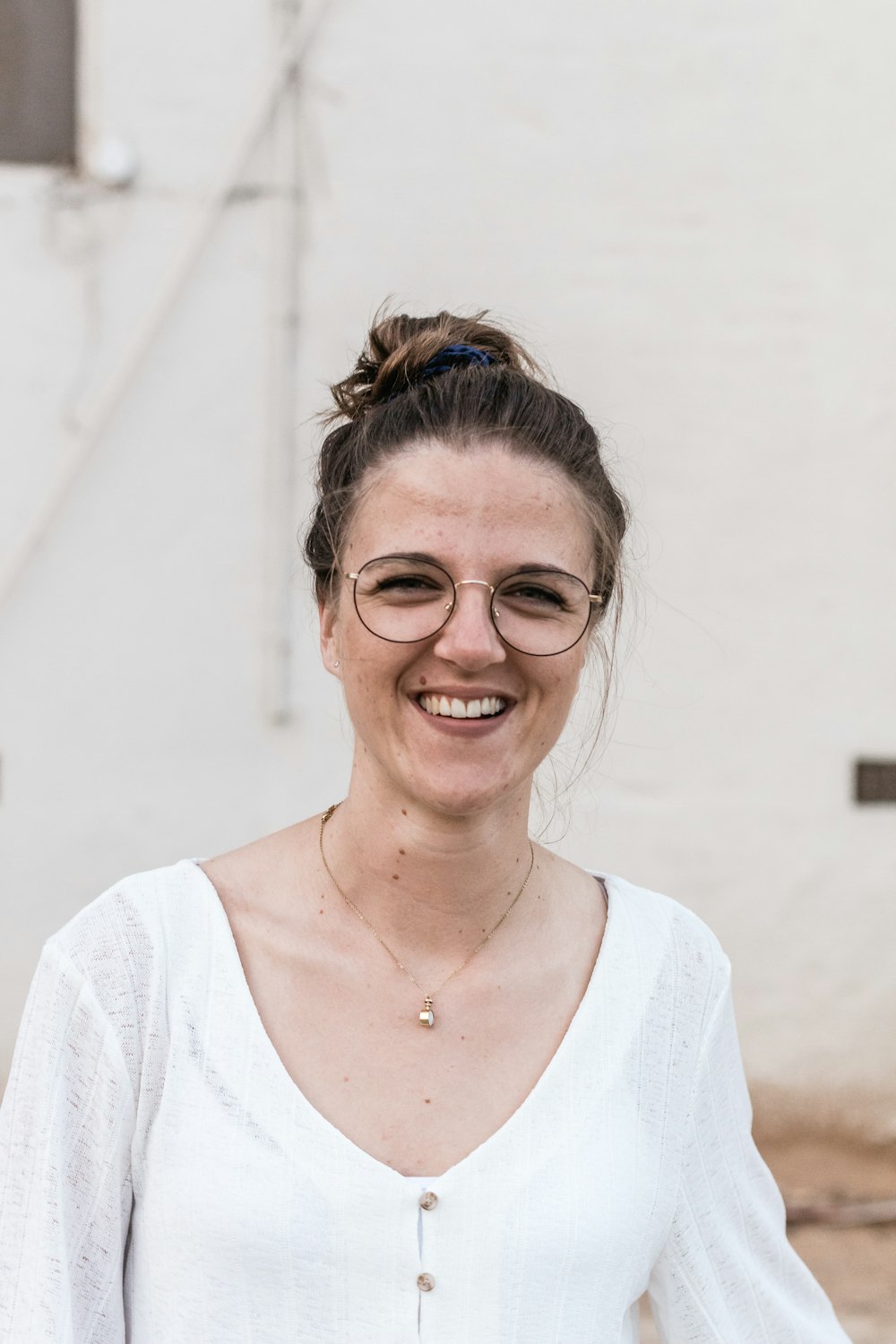 woman standing near white wall