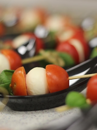 skewered tomato and cheese on plate