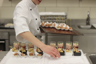 chef transferring food from tray