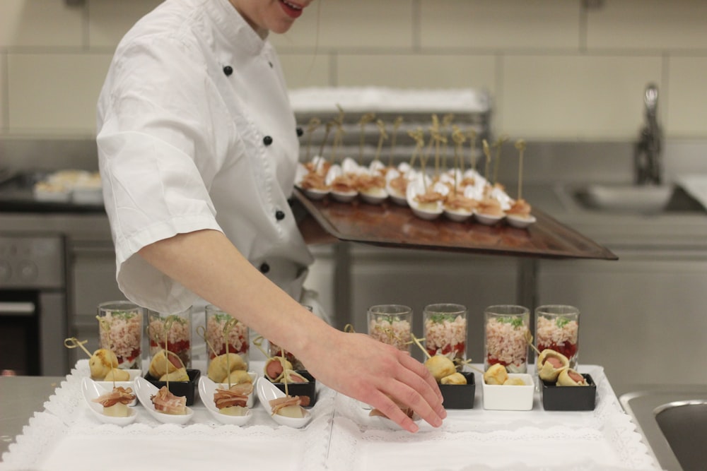 chef transferring food from tray