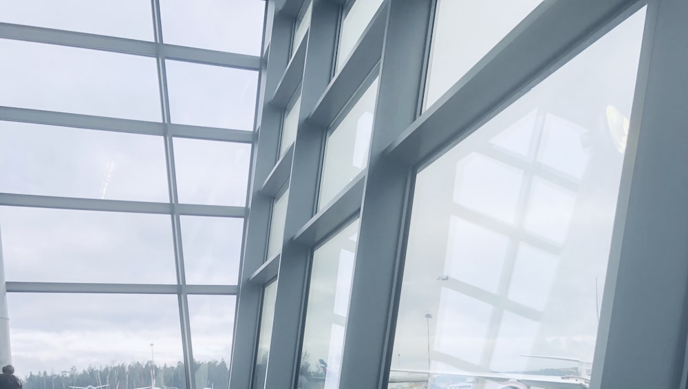 a man standing in front of a large window