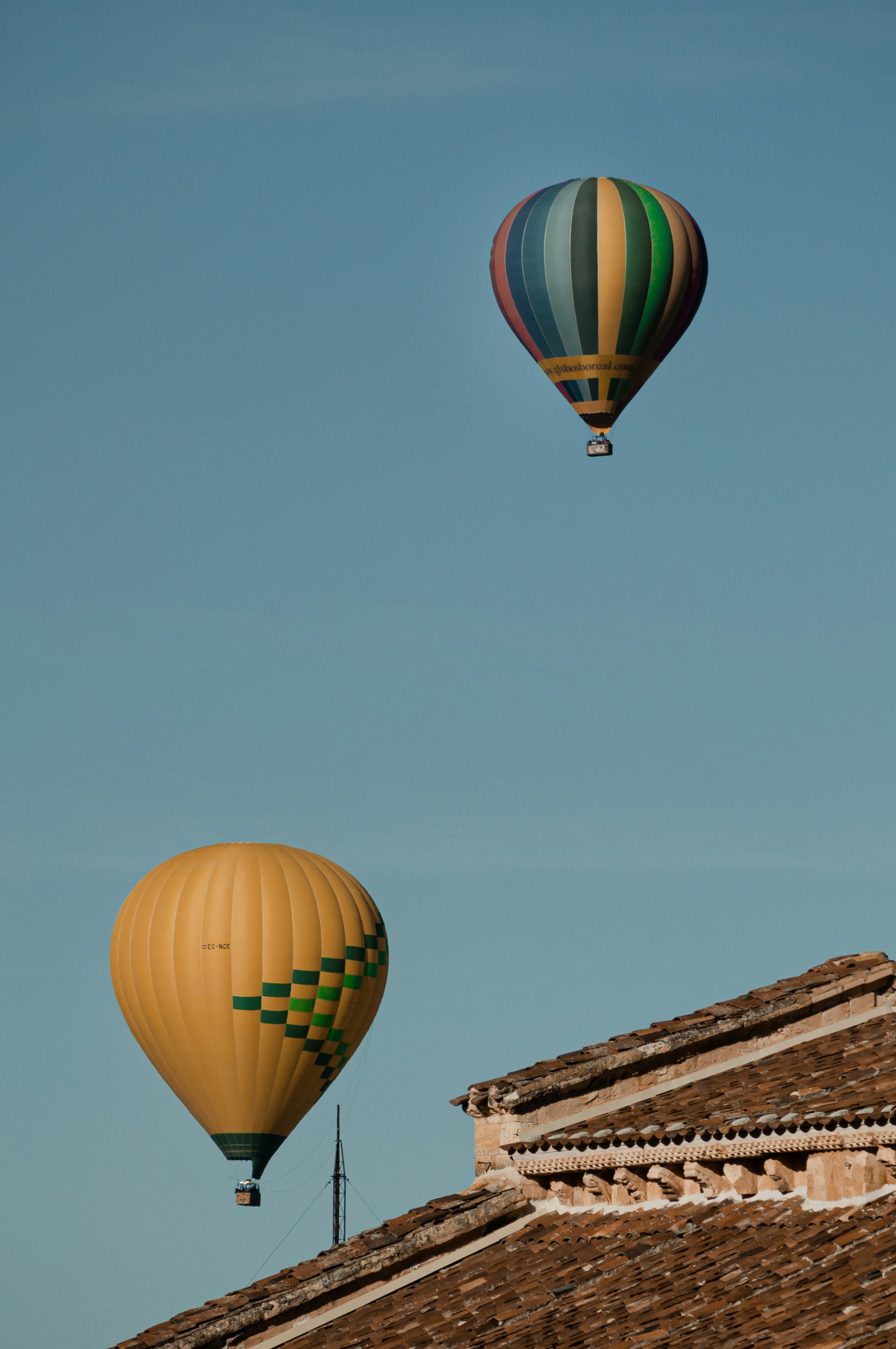 two blue and yellow hot air balloons