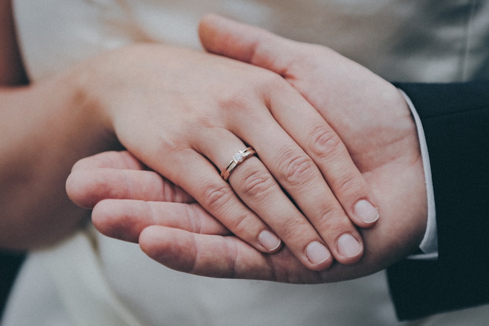 two person holding their hands