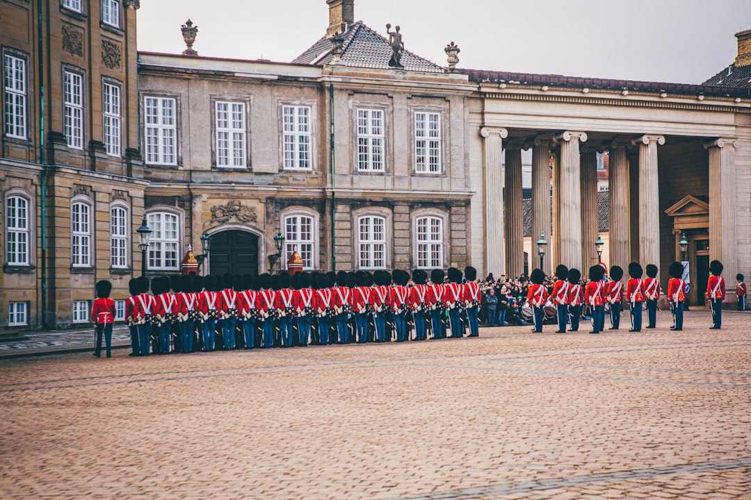 royal guard standing beside palace