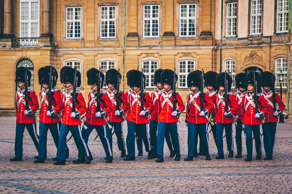 group of man marching on the pavement