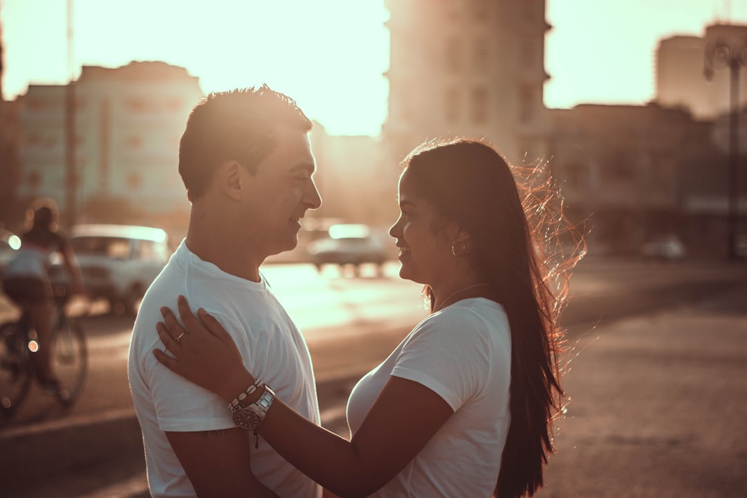 man and woman facing each other during daytime