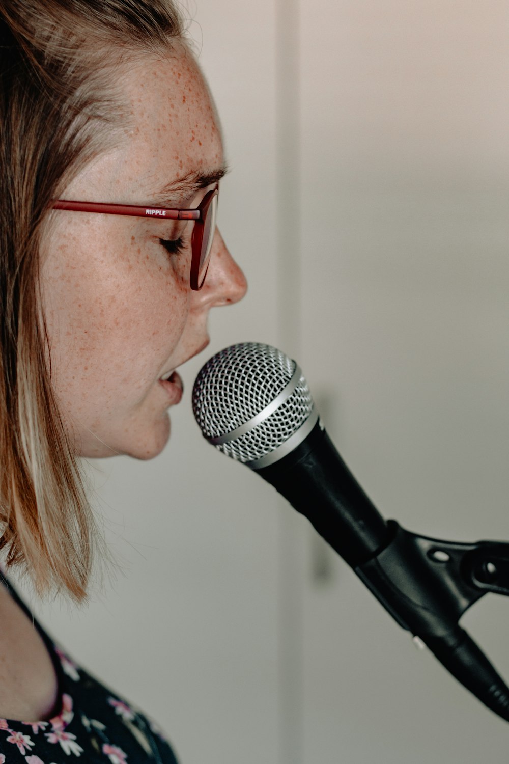 woman standing in front of microphone