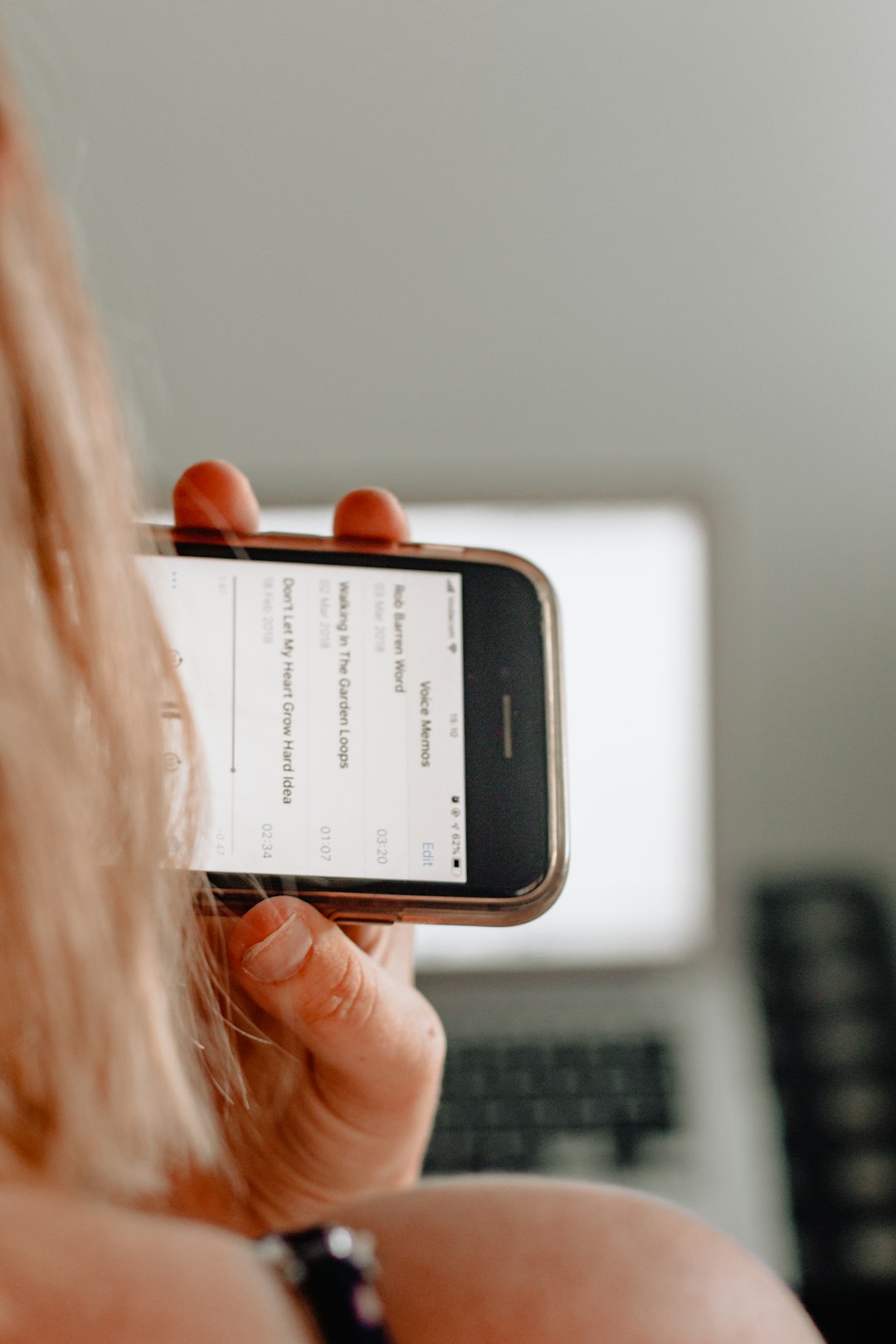 woman holding post-2014 iPhone