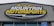 A large, rectangular business sign reads 'Mountain Motorsports' in bold letters. The text 'MOUNTAIN' is white, while 'MOTORSPORTS' is yellow, both set against a dark background. Above the text, there is an outline of mountain peaks in yellow.