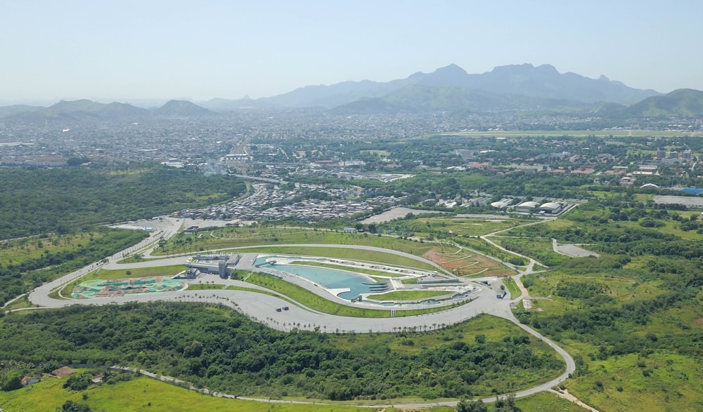 trees, roads, and buildings during daytime