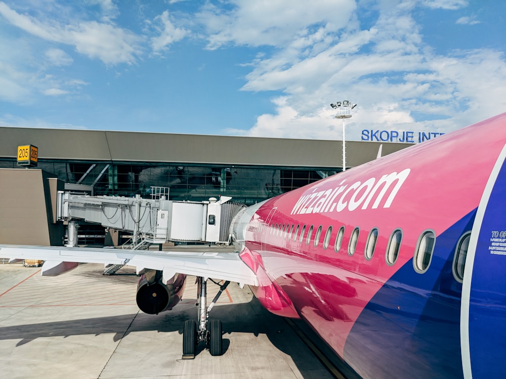 pink and blue airliner