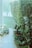 A lush garden setting with a variety of potted plants along a tiled pathway. Dense greenery is present in the form of a hedge bordering the right side. The scene is tranquil and inviting with a partially visible lawn and a mix of small and large foliage.