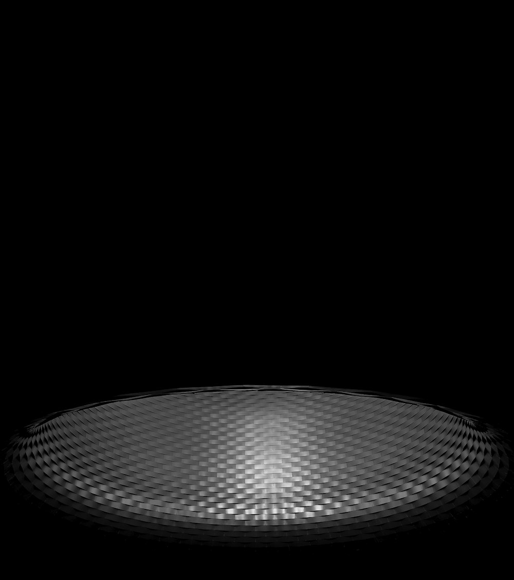 a black and white photo of a circular object