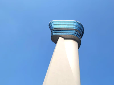 Inside a modern control tower with air traffic controllers monitoring flights.