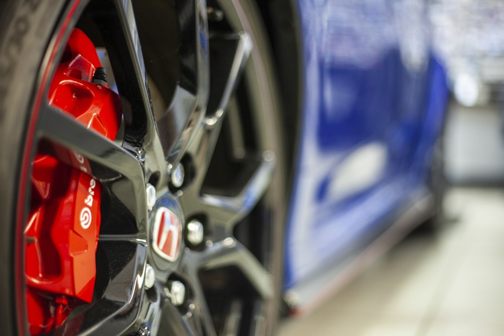 macro photography of black multi-spoke wheel and tire set