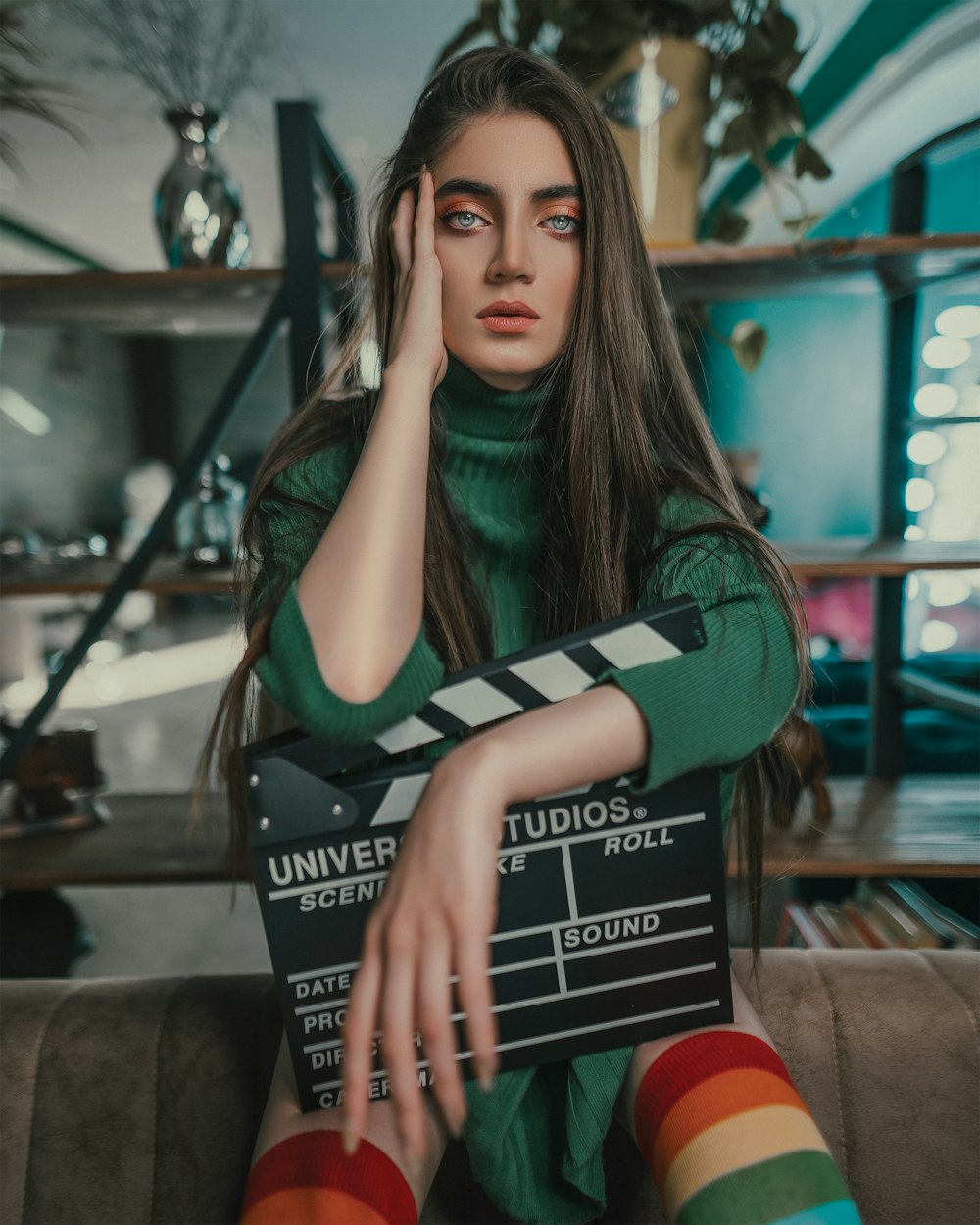 shallow focus photo of woman holding film clapper