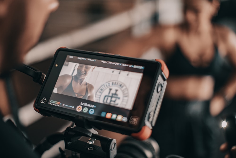 black camera viewing woman smiling