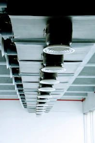 a group of lights hanging from the ceiling of a building