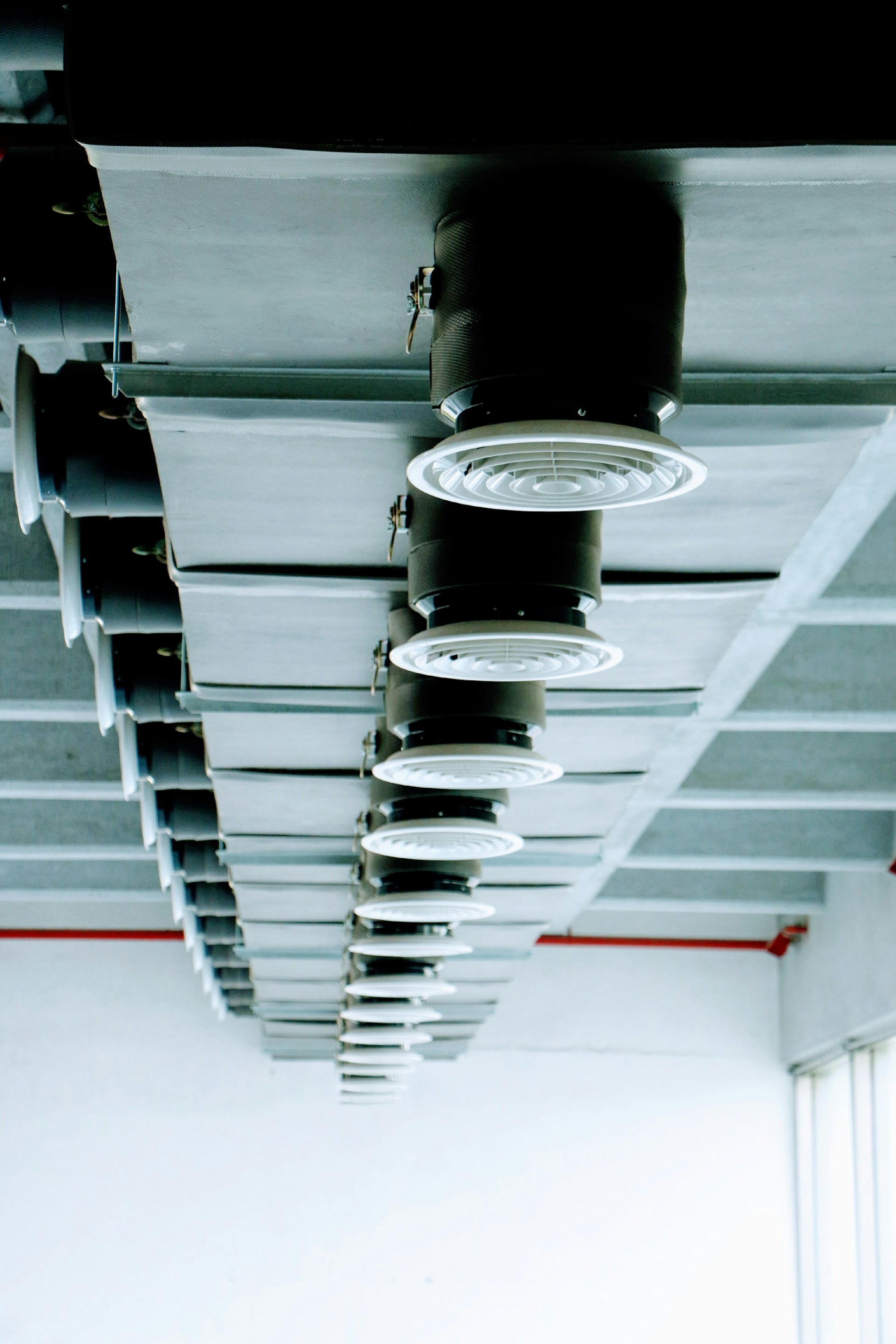 a group of lights hanging from the ceiling of a building