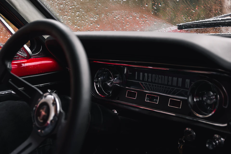 Steering wheel and dashboard of a 1965 Ford Mustang