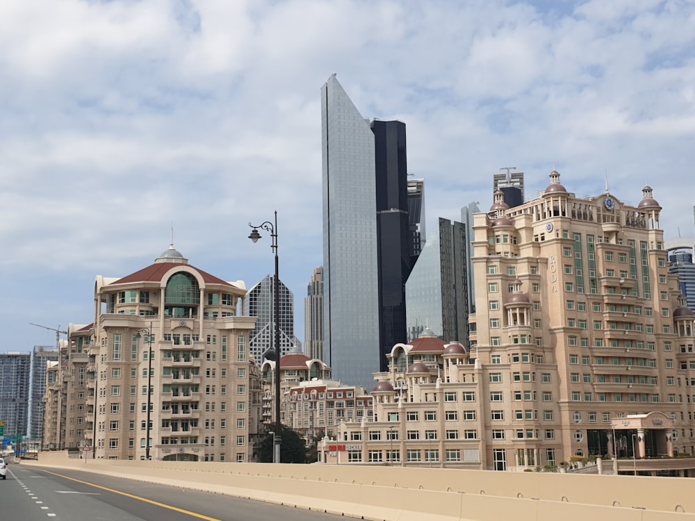 cityscape photography under white and blue sky