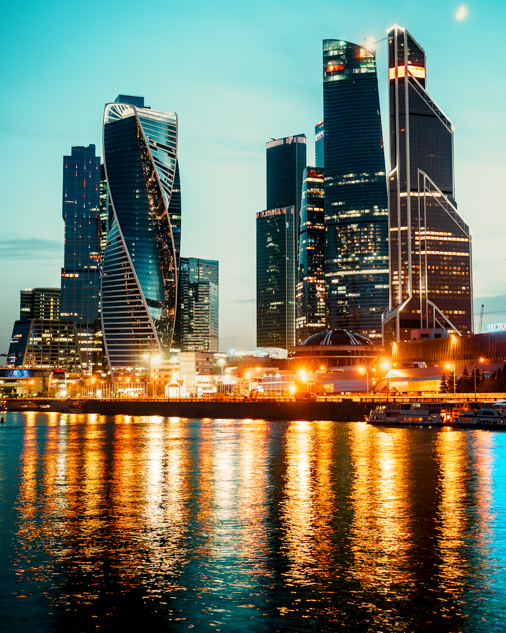 high rise buildings beside body of water