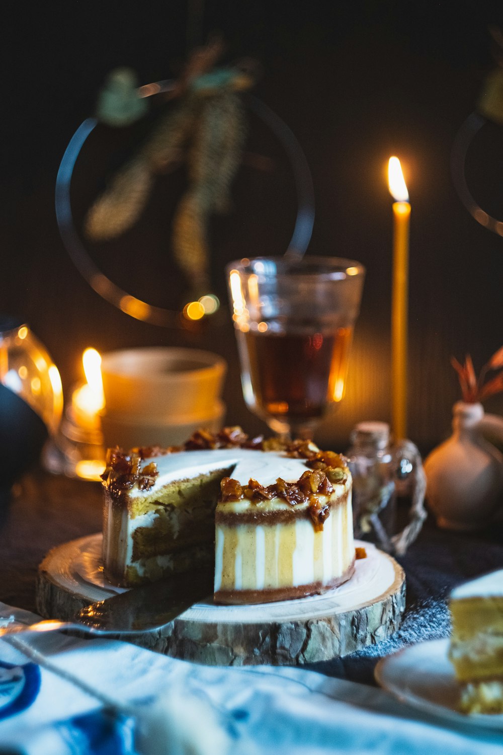 shallow focus photo of cake near lighted candle