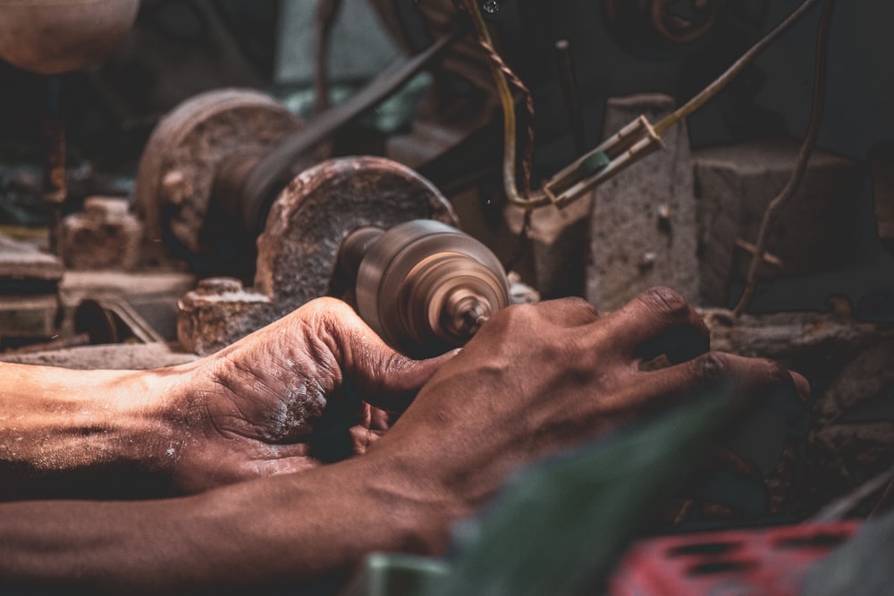 person using metal grinder