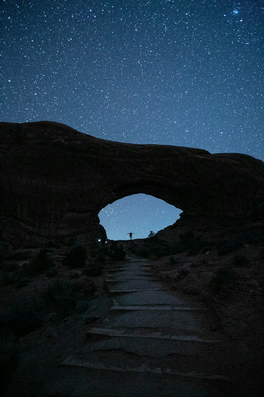 person standing near mountain during nighttime