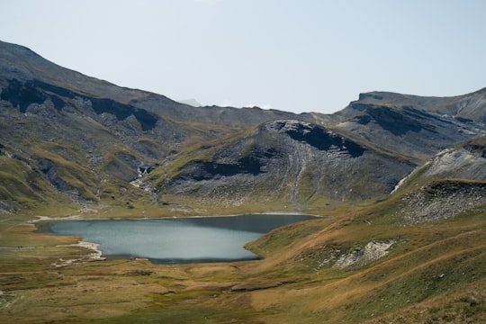 landscape photography of lake viewing mountain during daytime in Lac d'Anterne France