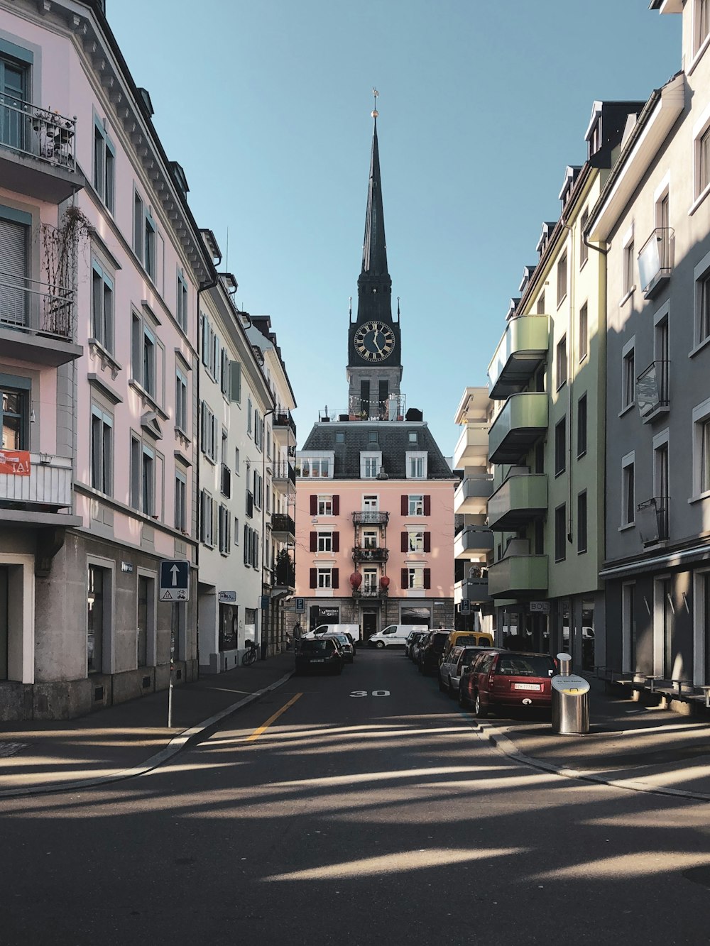 buildings, roads, and cars during daytime