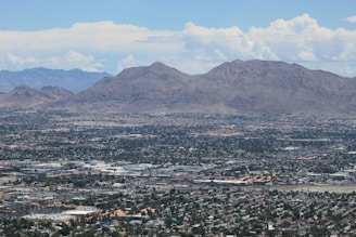 buildings and mountains during daytime